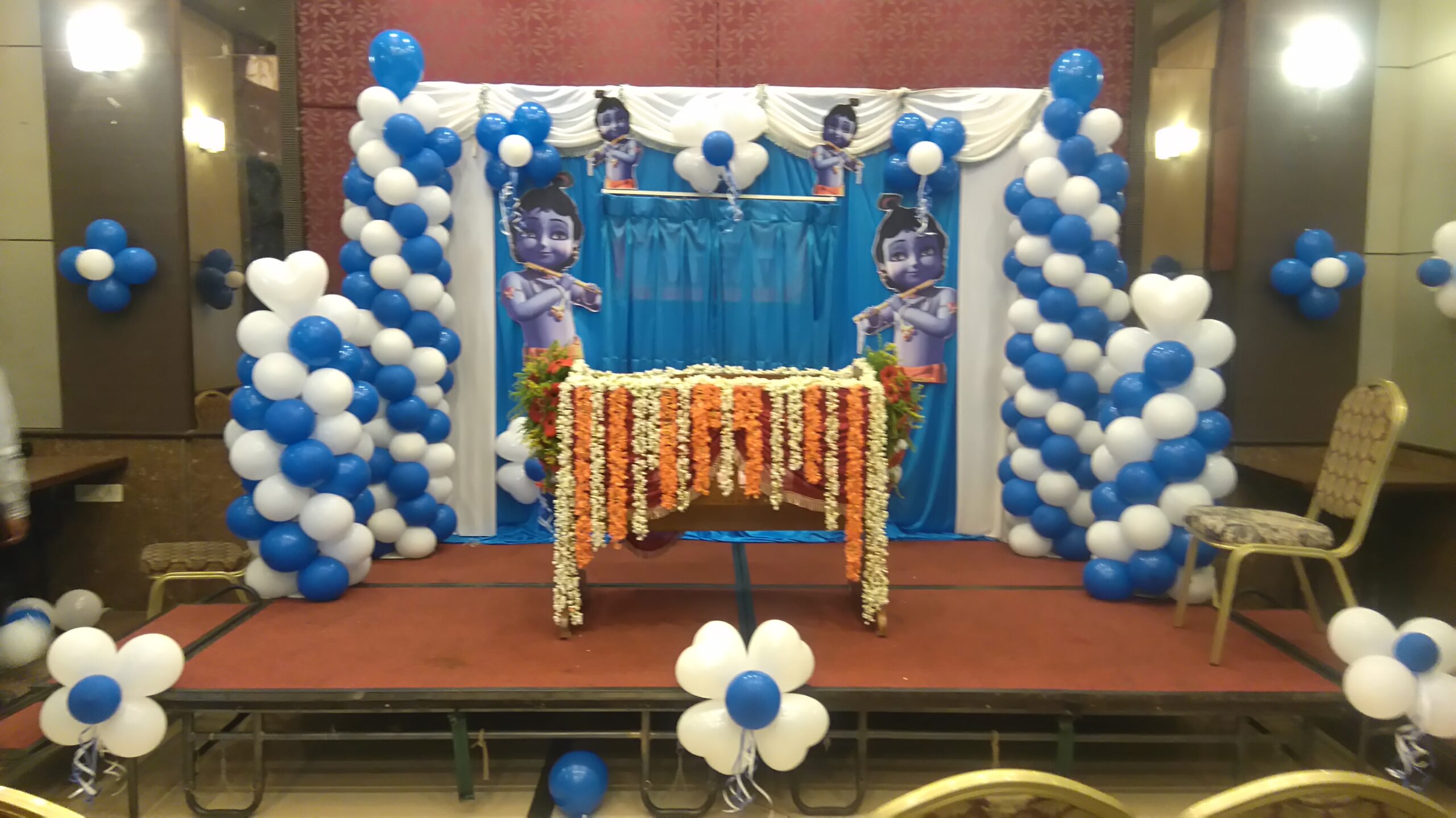 Floral Krishna- themed balloon decoration for Naming Ceremony