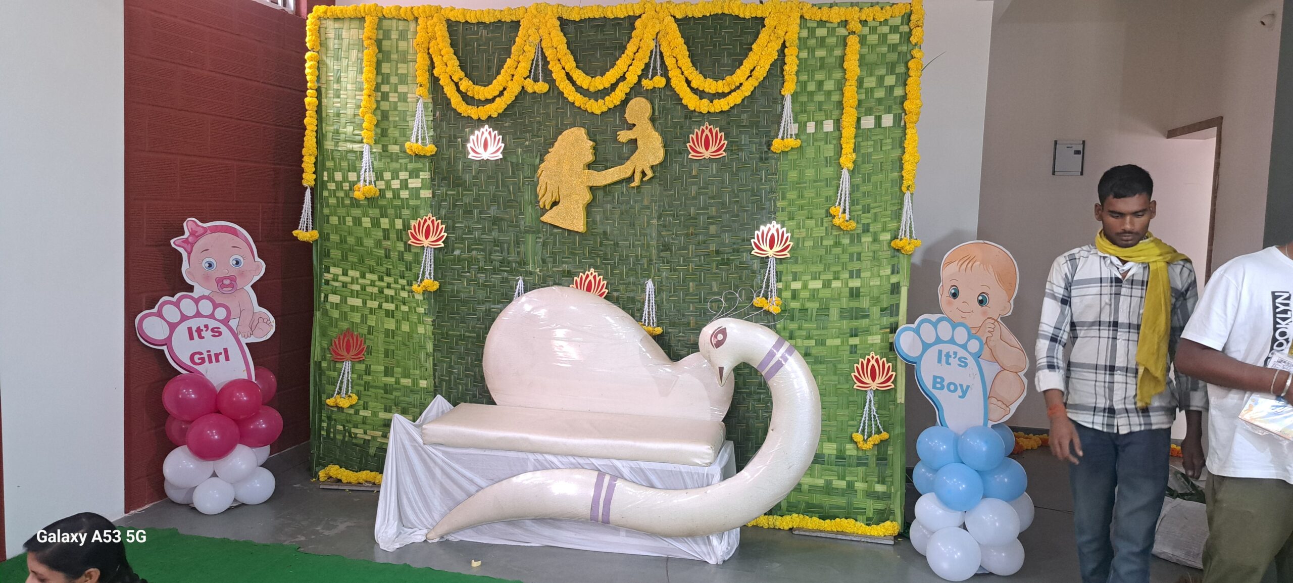 Coconut Leaves and Yellow Marigold with Artificial Lotus Decor