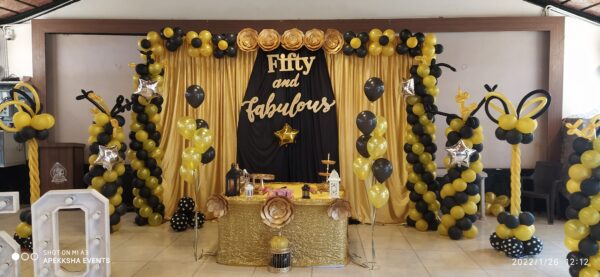 Metallic Gold and Black Themed Balloon Decoration for Anniversary
