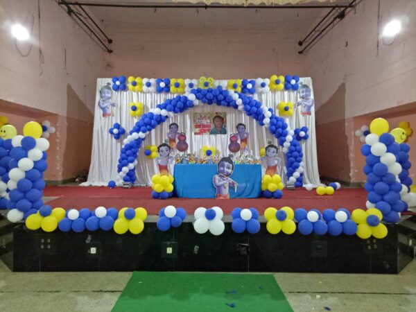 Krishna-themed Blue, White and Yellow Balloon Decoration